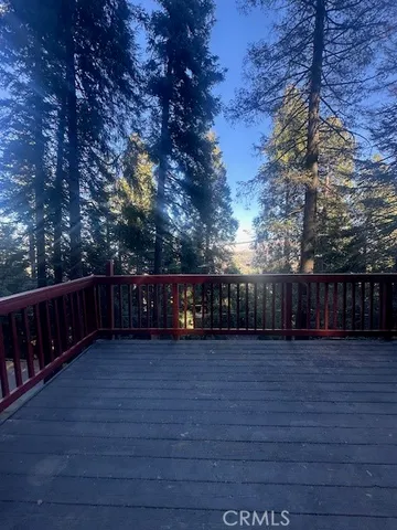 a view of swimming pool with wooden fence