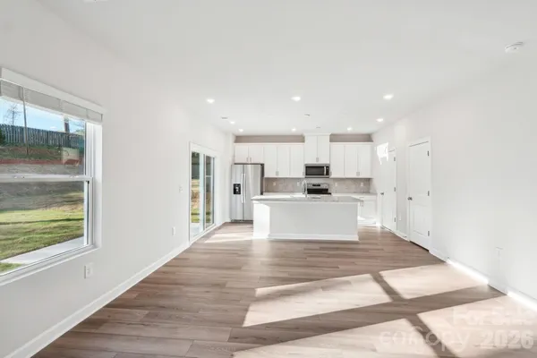 a view of kitchen with wooden floor