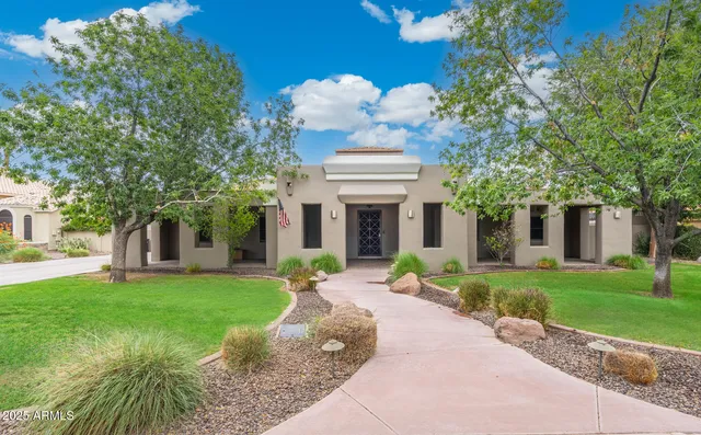 a kitchen with stainless steel appliances kitchen island granite countertop a sink and cabinets