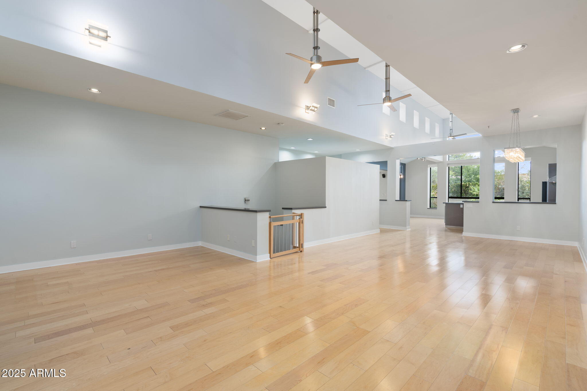 9433 South Stanley Place Tempe, AZ 85284 - Photo 12 of 47 a view of an empty room with wooden floor