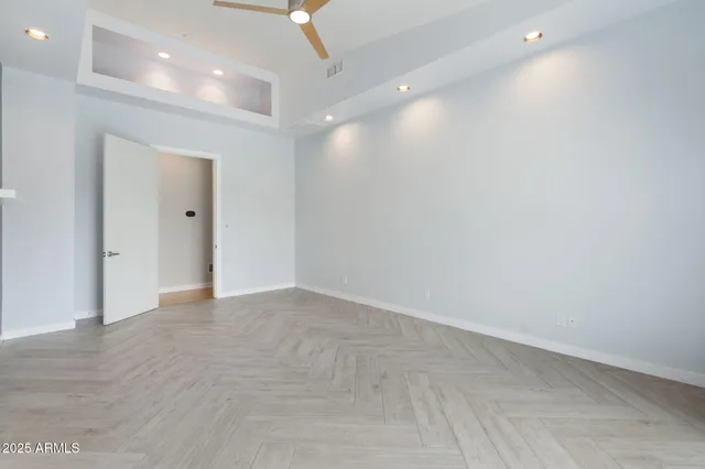 an empty room with closet area