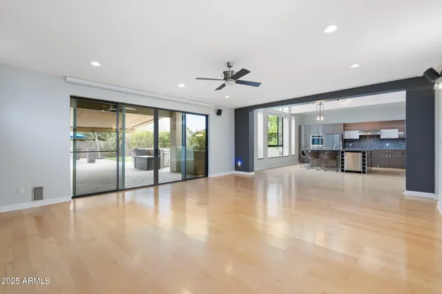 a view of an empty room with a kitchen