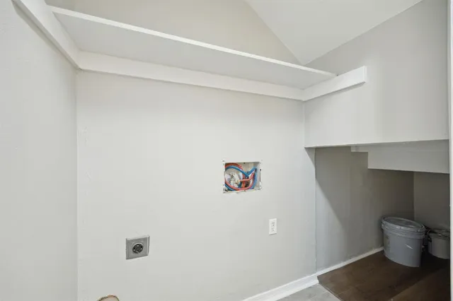 a bathroom with a toilet and a shower curtain