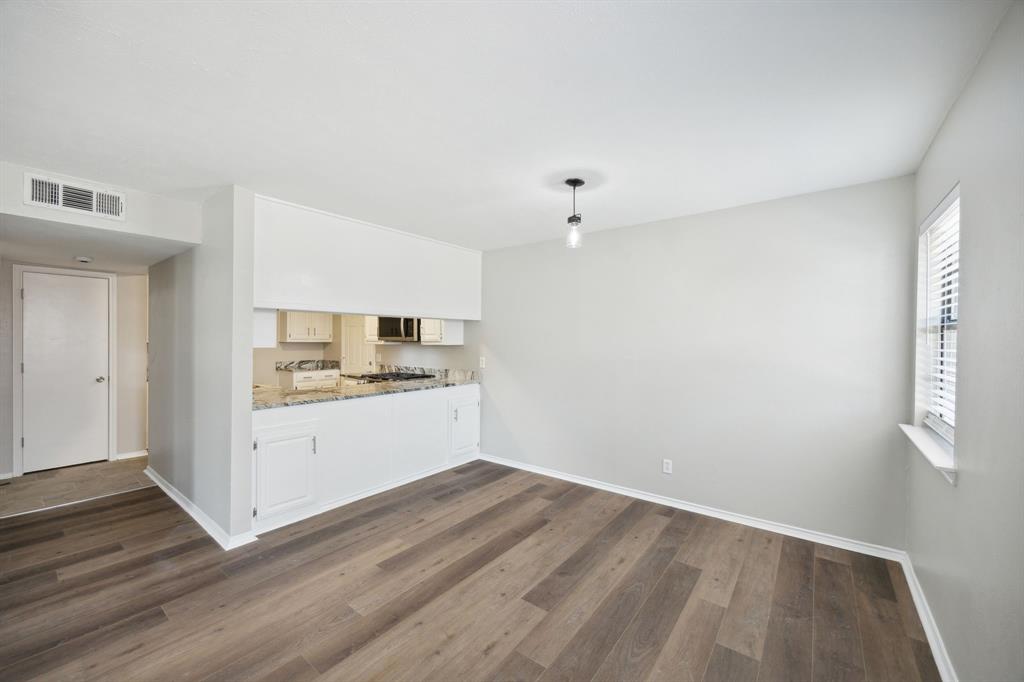 2420 Lakeview Circle McKinney, TX 75072 - Photo 19 of 25 a view of a kitchen with wooden floor and electronic appliances