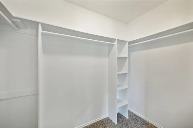a view of an empty walk in closet