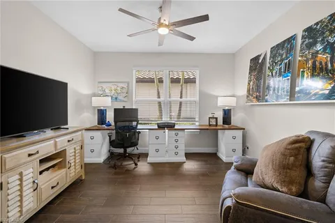 a bedroom with a bed and a table in it