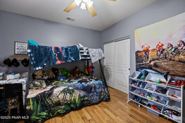 a bed room with a bed and a book shelf