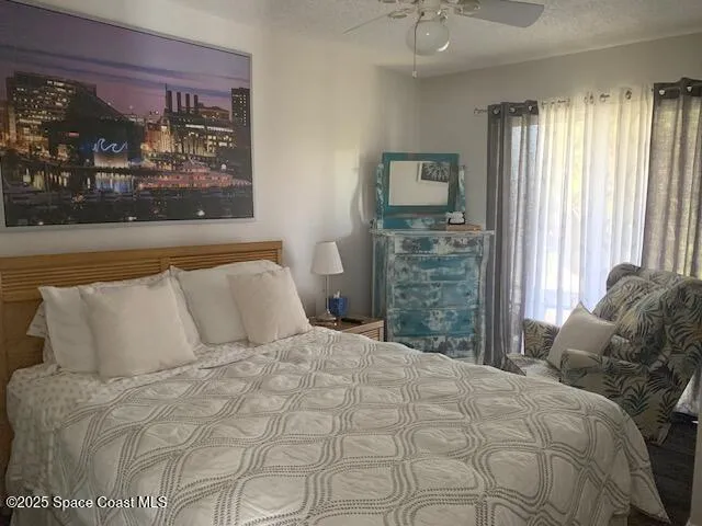 a view of a balcony with an outdoor seating