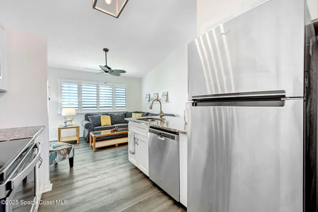 a living room with furniture fireplace and a flat screen tv