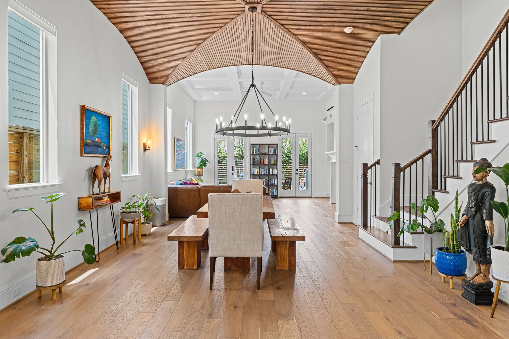 533 West 27th Street Houston, TX 77008 - Photo 5 of 22 Dining room is highlighted by soaring ceilings and a dramatic groin-vault wood ceiling that anchors the open living spaces.