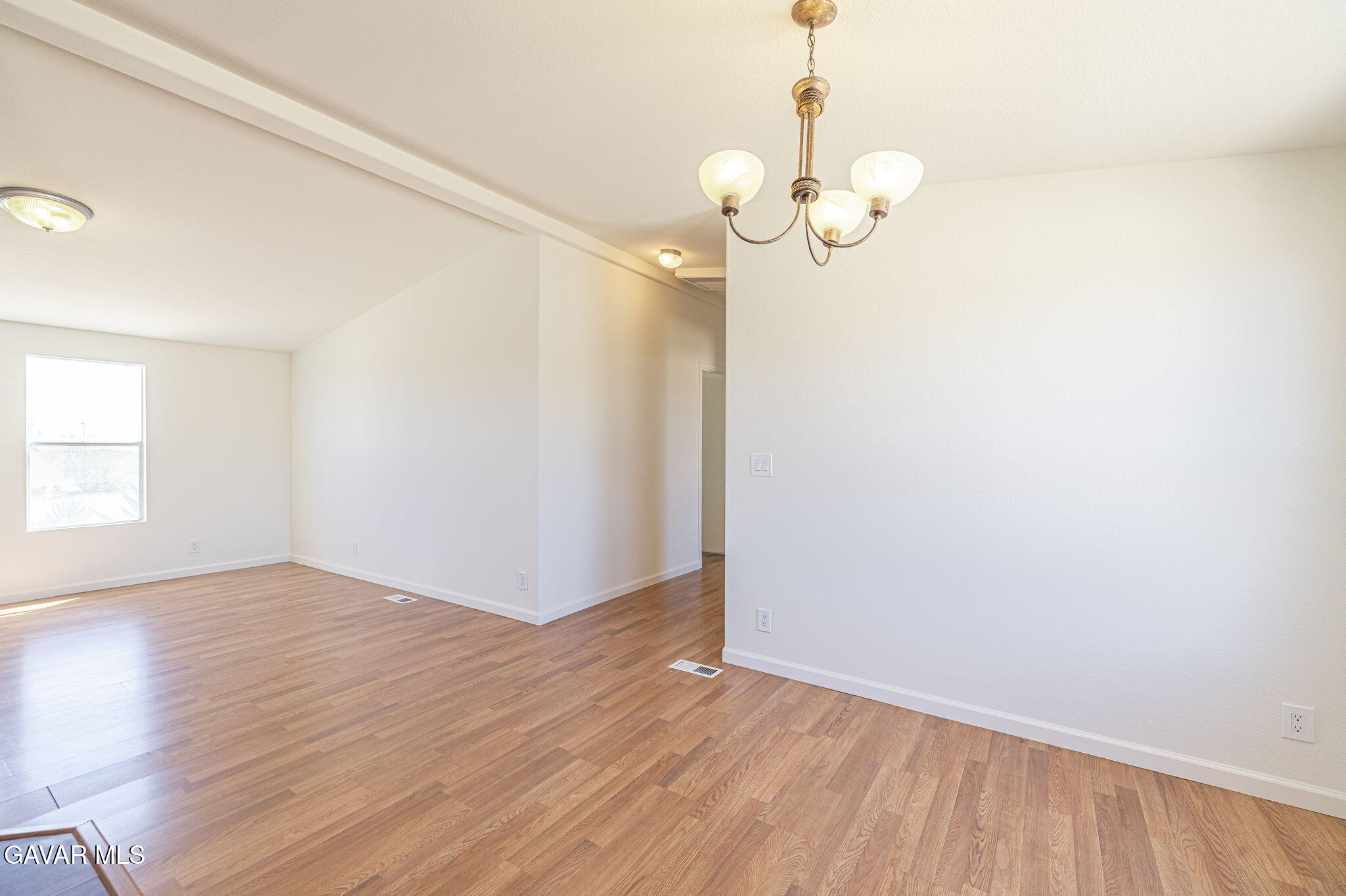 26321 Olanche Street Mojave, CA 93501 - Photo 11 of 40 wooden floor in an empty room with a window