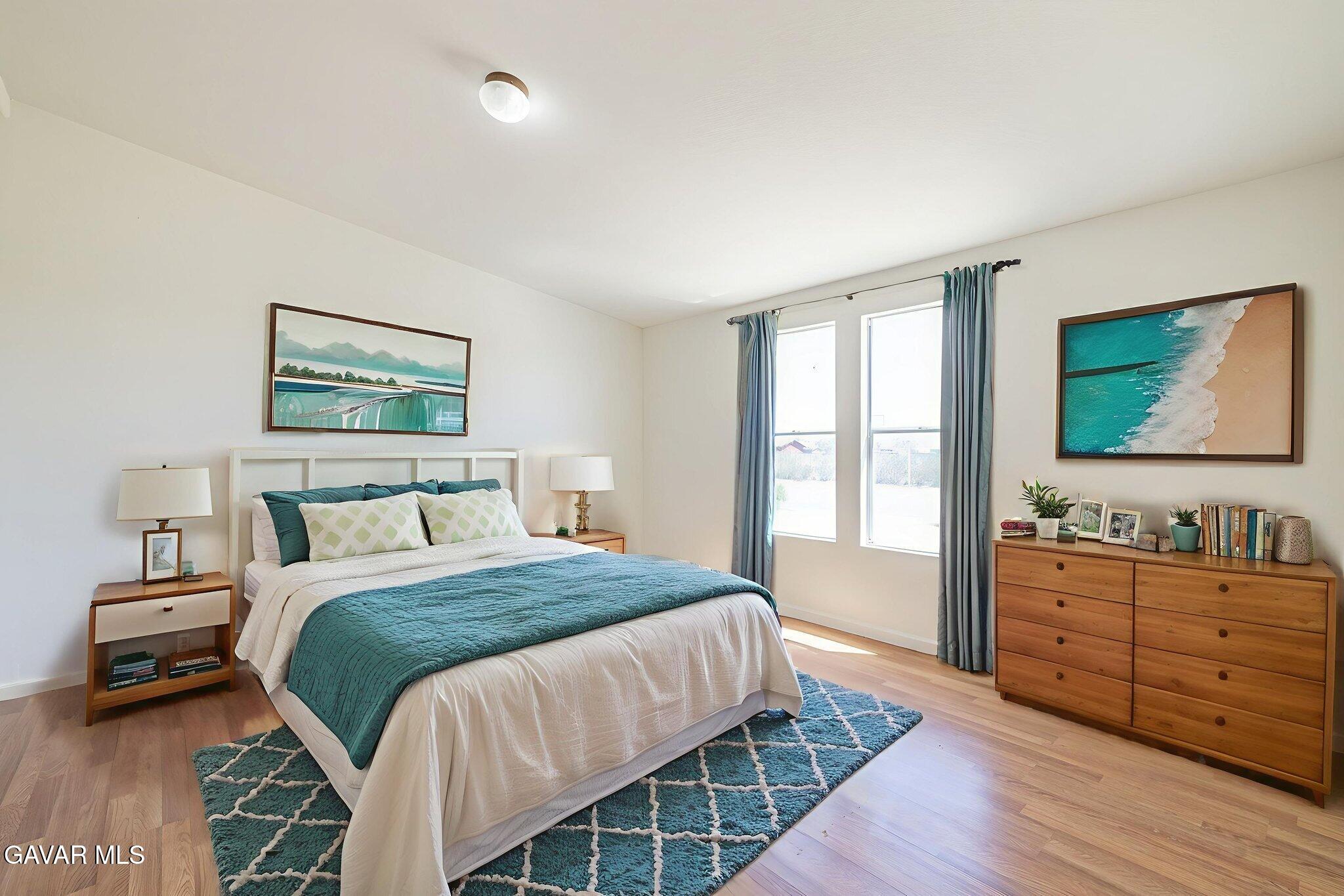 26321 Olanche Street Mojave, CA 93501 - Photo 16 of 40 a bedroom with a bed and a dresser