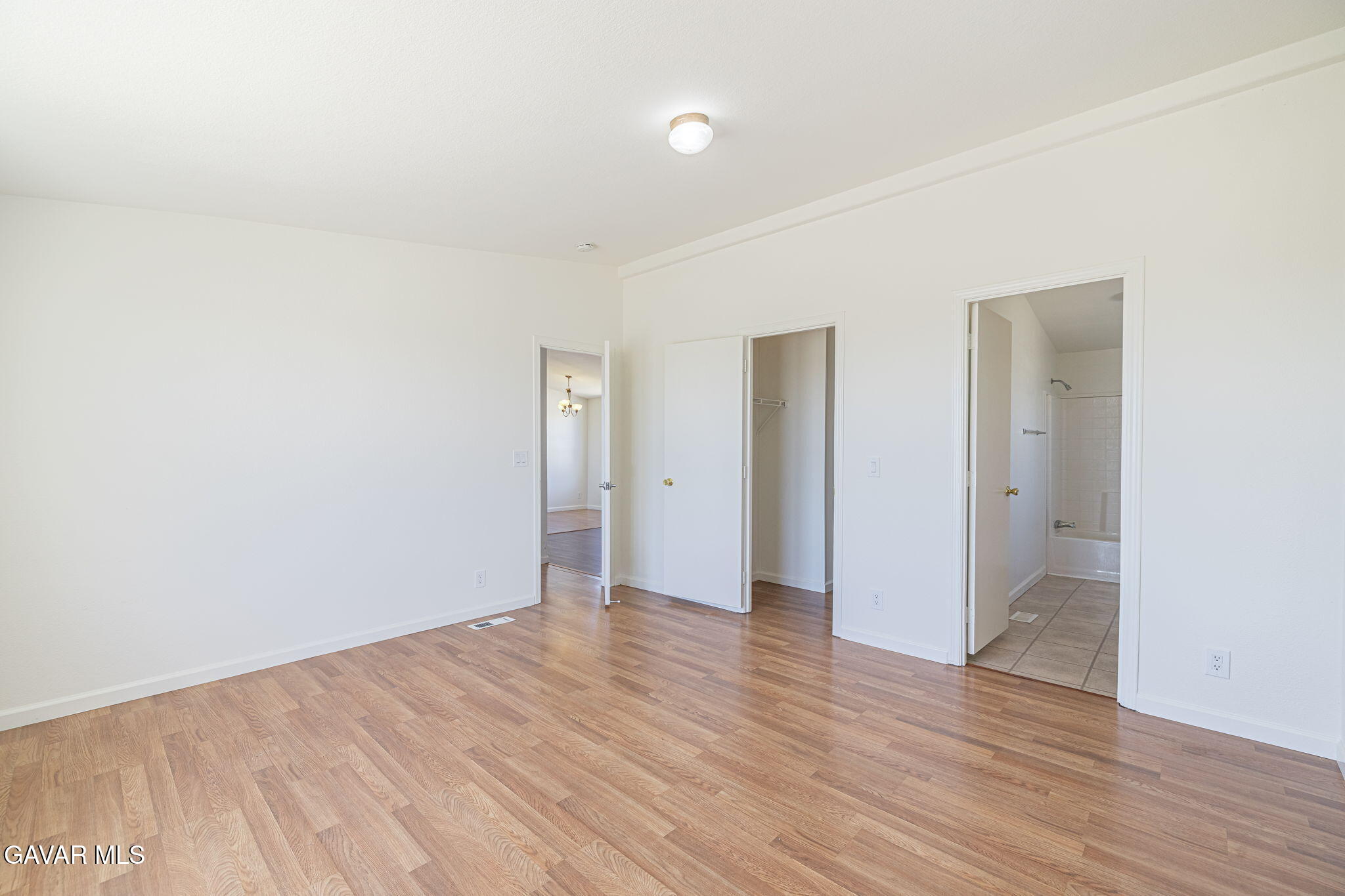 26321 Olanche Street Mojave, CA 93501 - Photo 18 of 40 a view of an empty room with wooden floor and closet