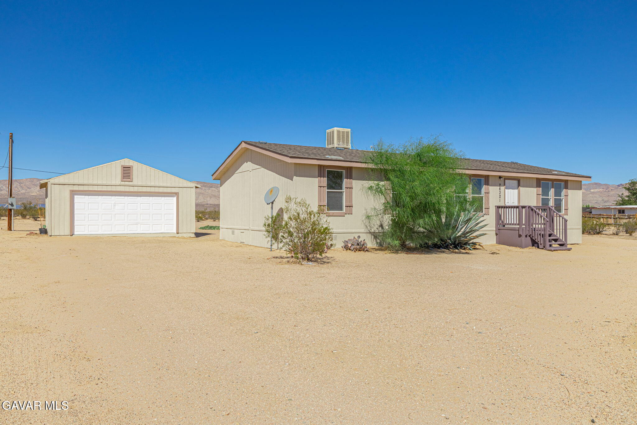 26321 Olanche Street Mojave, CA 93501 - Photo 3 of 40 a view of a house with a outdoor space