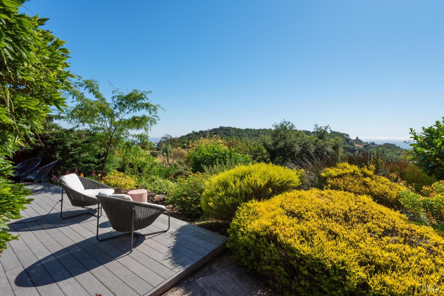 6960 Round Oak Road Penngrove, CA 94951 - Photo 50 of 58 a roof deck with table and chairs and potted plants