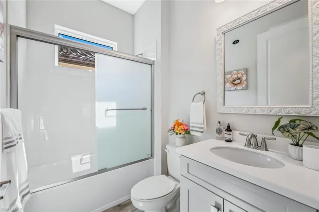 a bedroom with bed and a window