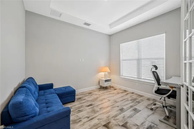 a bedroom with bed and a window