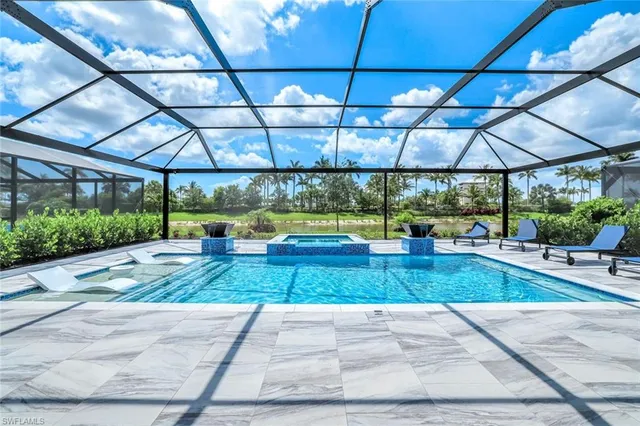 a dining room with furniture and a chandelier