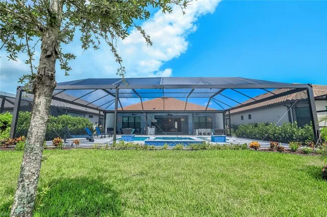 a front view of a house with a garden and yard