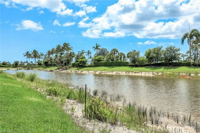 a view of a house with a yard patio and sitting area