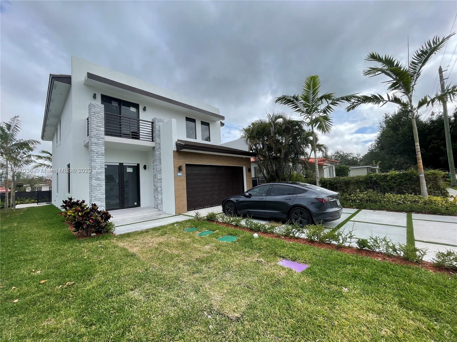 6535 Southwest 26th Street Miami, FL 33155 - Photo 2 of 19 a backyard of a house with garden and entertaining space