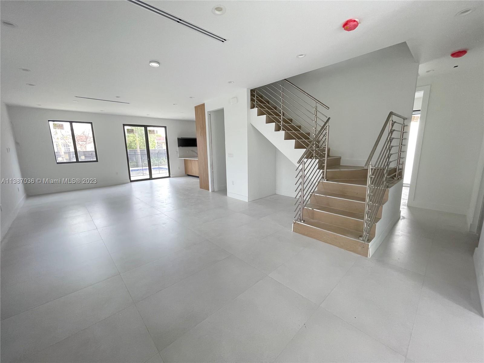 6535 Southwest 26th Street Miami, FL 33155 - Photo 9 of 19 a view of entryway and hall with wooden floor