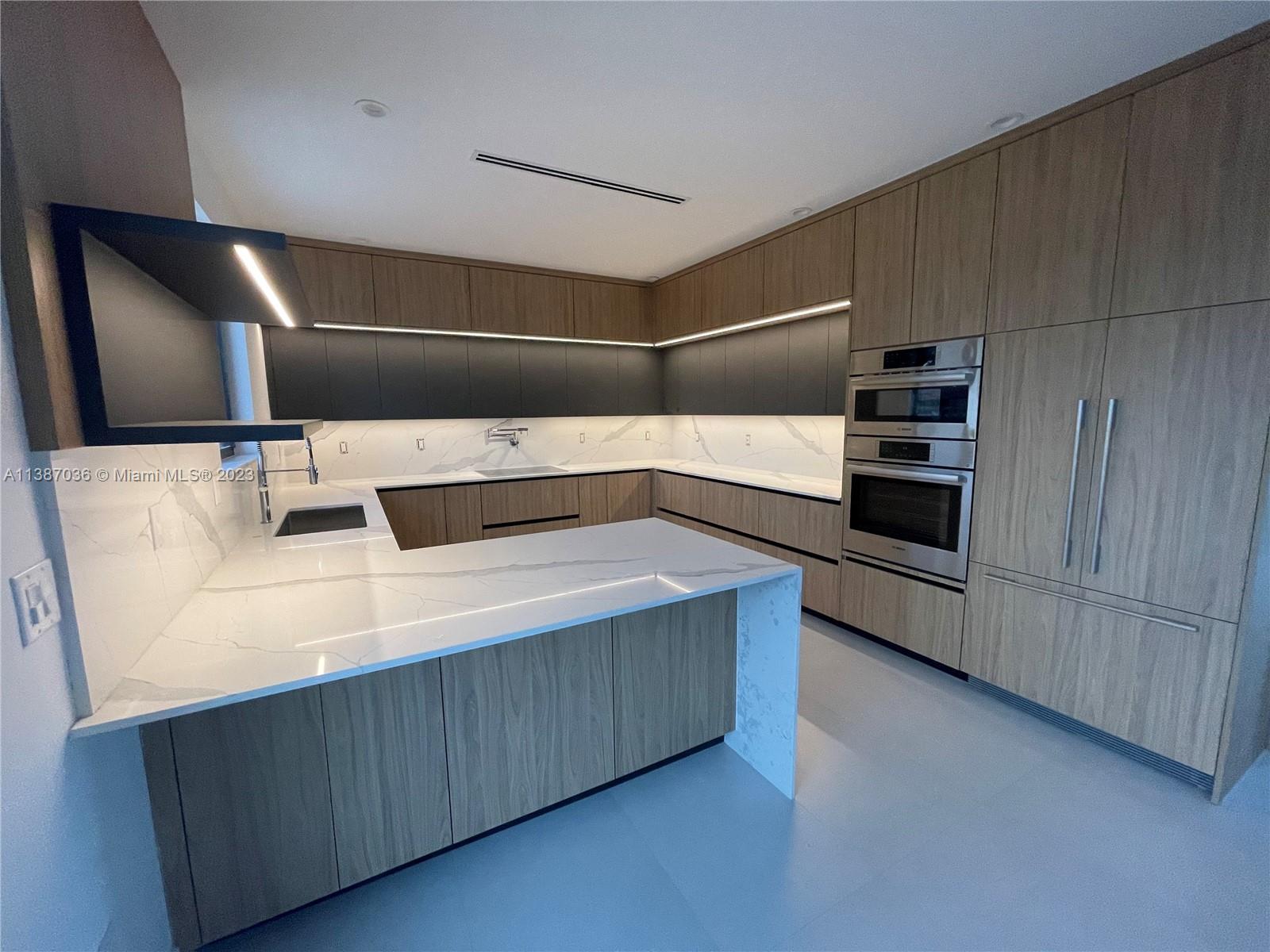 6535 Southwest 26th Street Miami, FL 33155 - Photo 10 of 19 a kitchen with kitchen island a sink appliances and cabinets