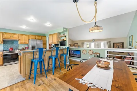 a view of a living room and kitchen