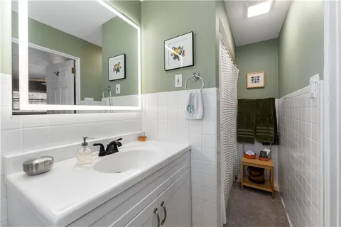 a bathroom with a sink and a mirror