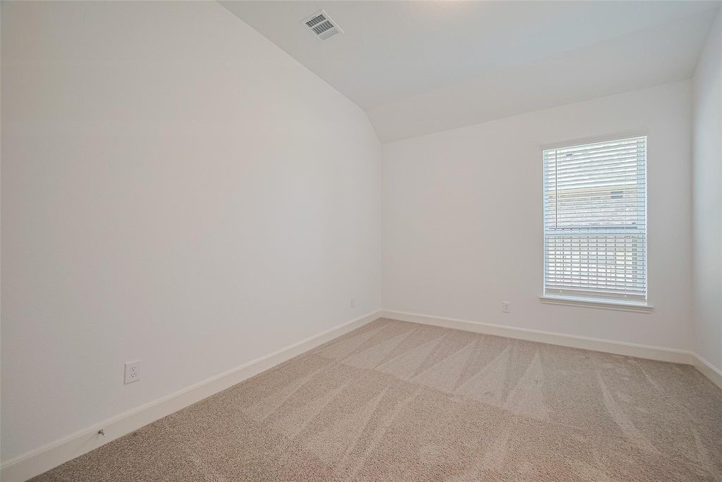 1051 Comal Trail Dayton, TX 77535 - Photo 20 of 49 an empty room with a window