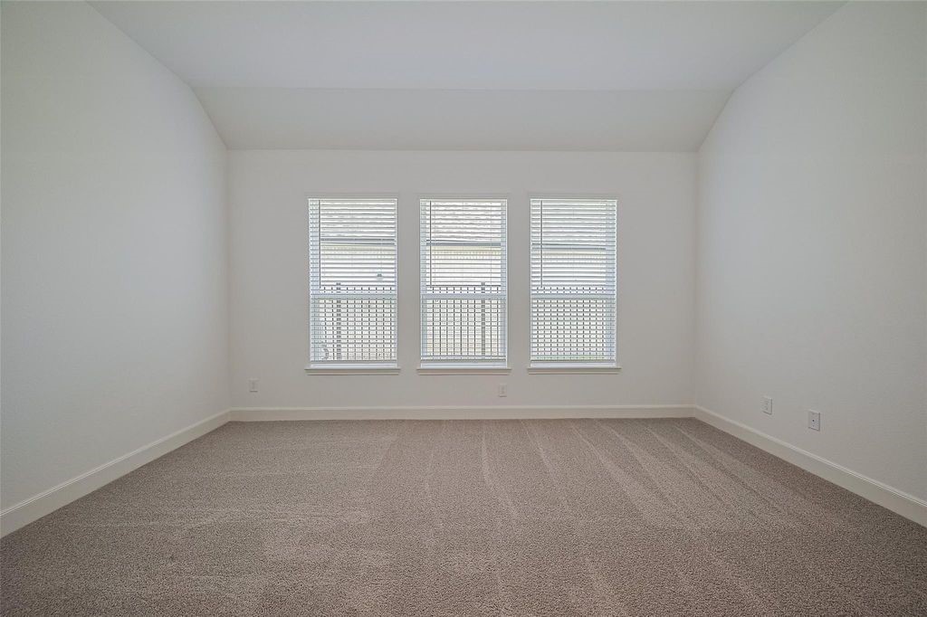1051 Comal Trail Dayton, TX 77535 - Photo 27 of 49 an empty room with a window