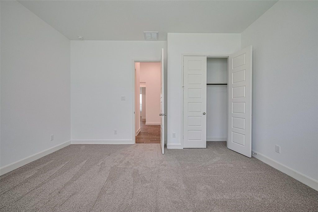 1051 Comal Trail Dayton, TX 77535 - Photo 29 of 49 an empty room with closet area