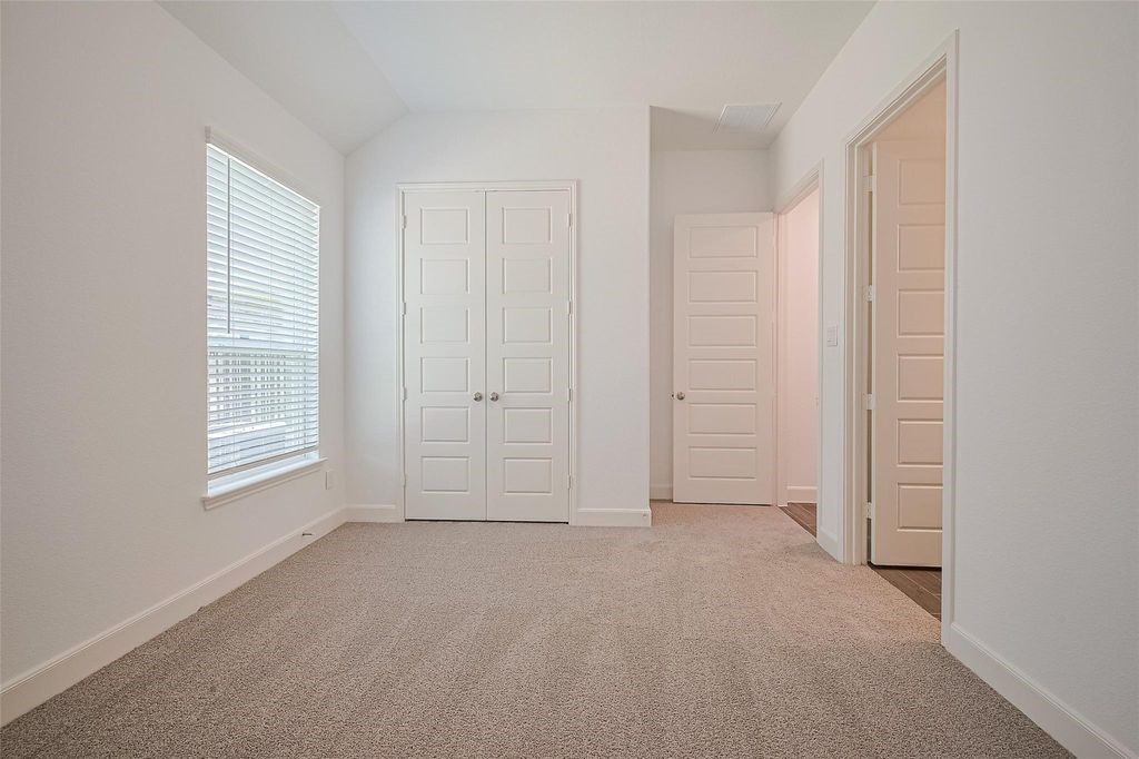 1051 Comal Trail Dayton, TX 77535 - Photo 34 of 49 an empty room with windows
