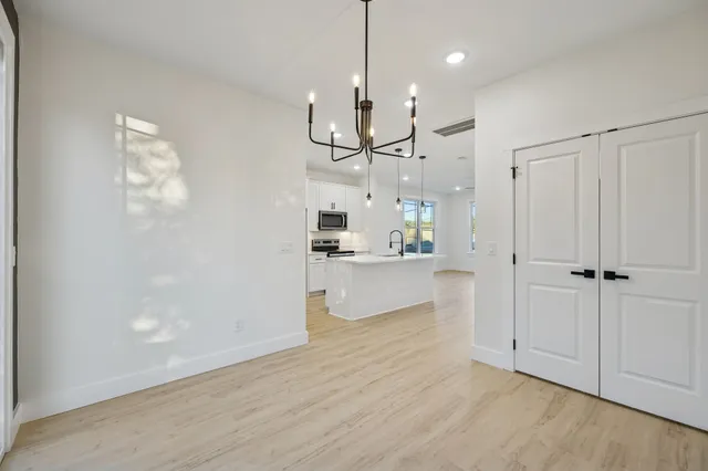 a view of a kitchen and chandelier