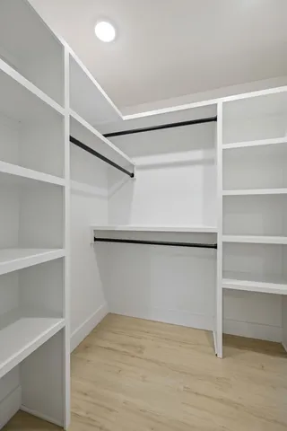 a view of an empty walk in closet