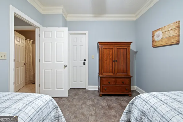 a bedroom with a bed and a dresser