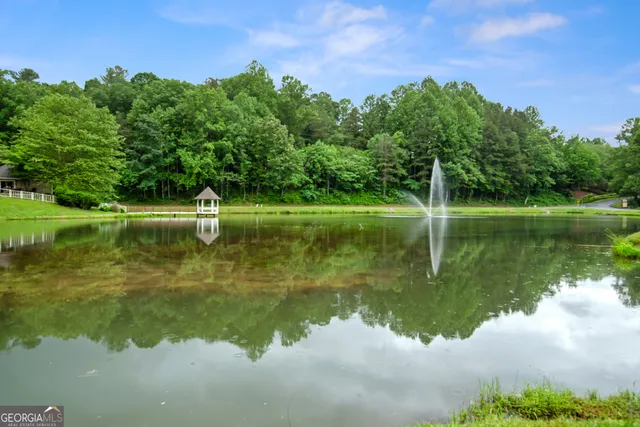 a view of a lake in between two chairs