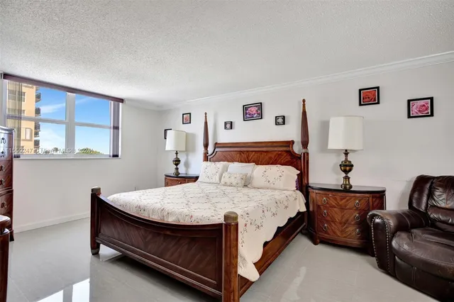 a view of walk in closet with clothes