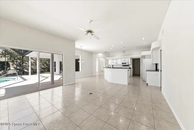 a view of a kitchen with a sink and a stove top oven