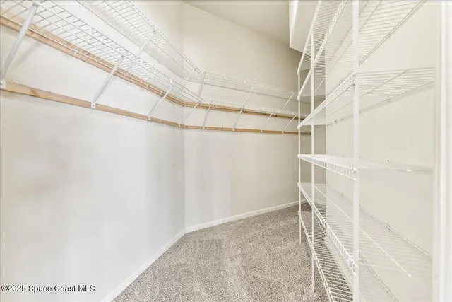 a view of a room with racks on the wall