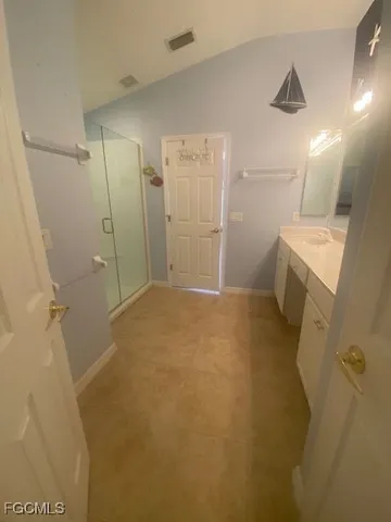 a bathroom with a sink and shower