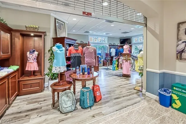 a living room filled with furniture and a potted plant