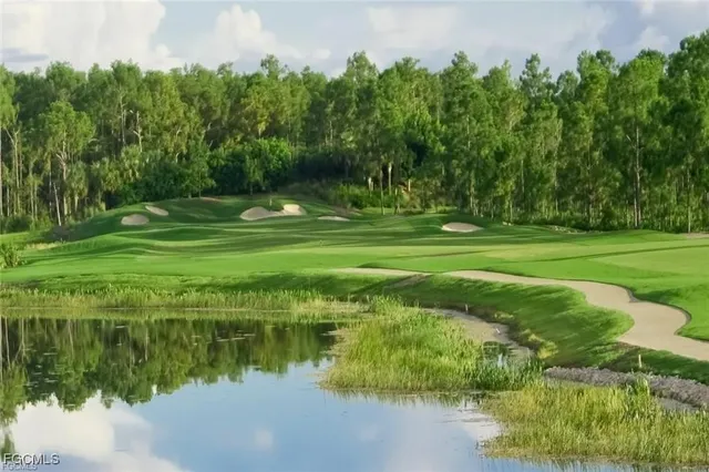 a view of a golf course with a lake