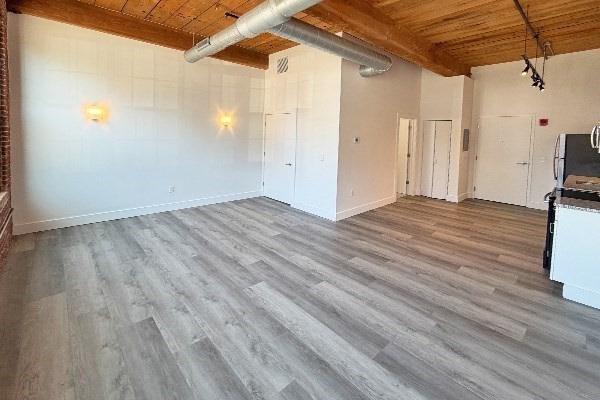 60 Water Street, Unit 2012 North Andover, MA 01845 - Photo 4 of 5 a view of empty room with wooden floor