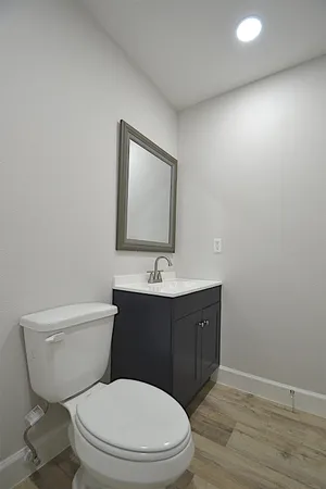 a bathroom with a white bath tub and a shower