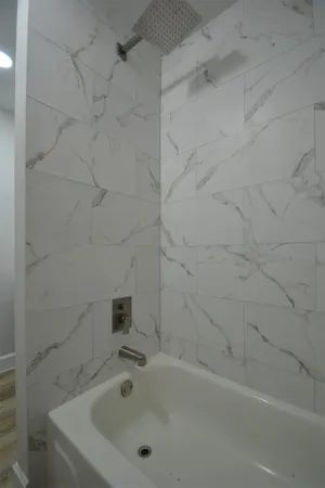a bathroom with a sink vanity and mirror