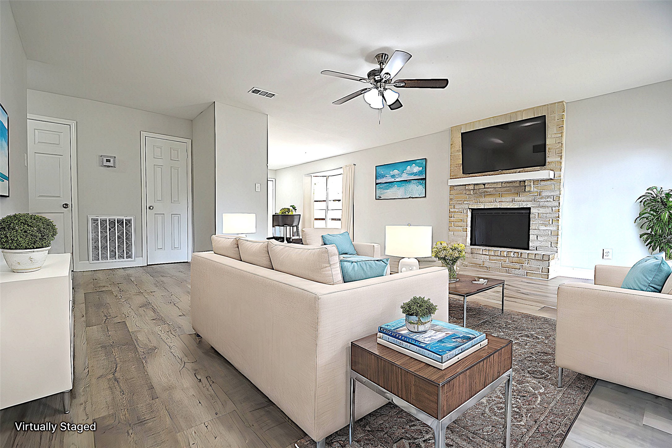 4527 Adonis Drive Spring, TX 77373 - Photo 4 of 32 a living room with furniture a fireplace and a flat screen tv