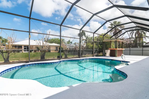 a view of swimming pool with an outdoor seating