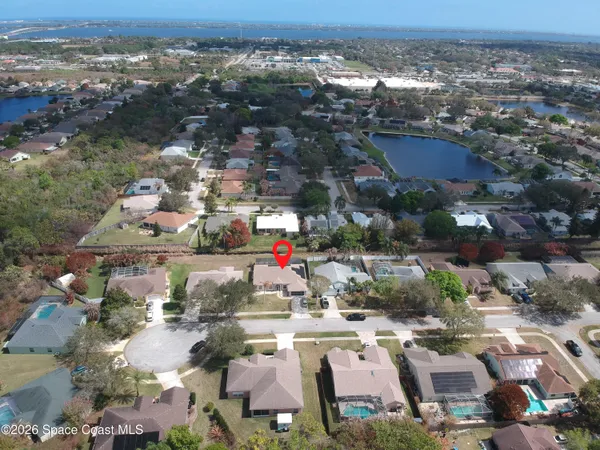 an aerial view of residential houses with outdoor space