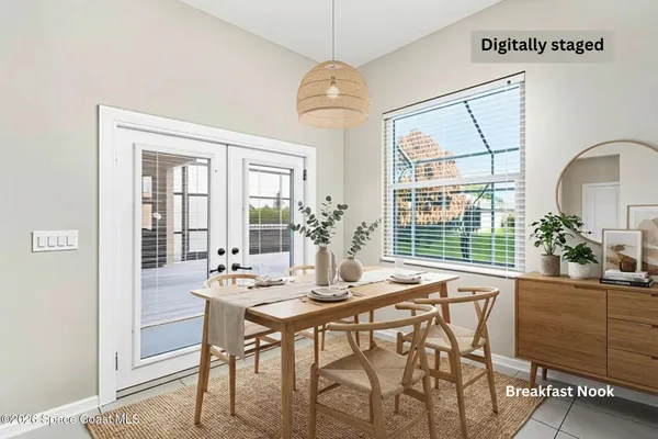 a dining room with furniture and window